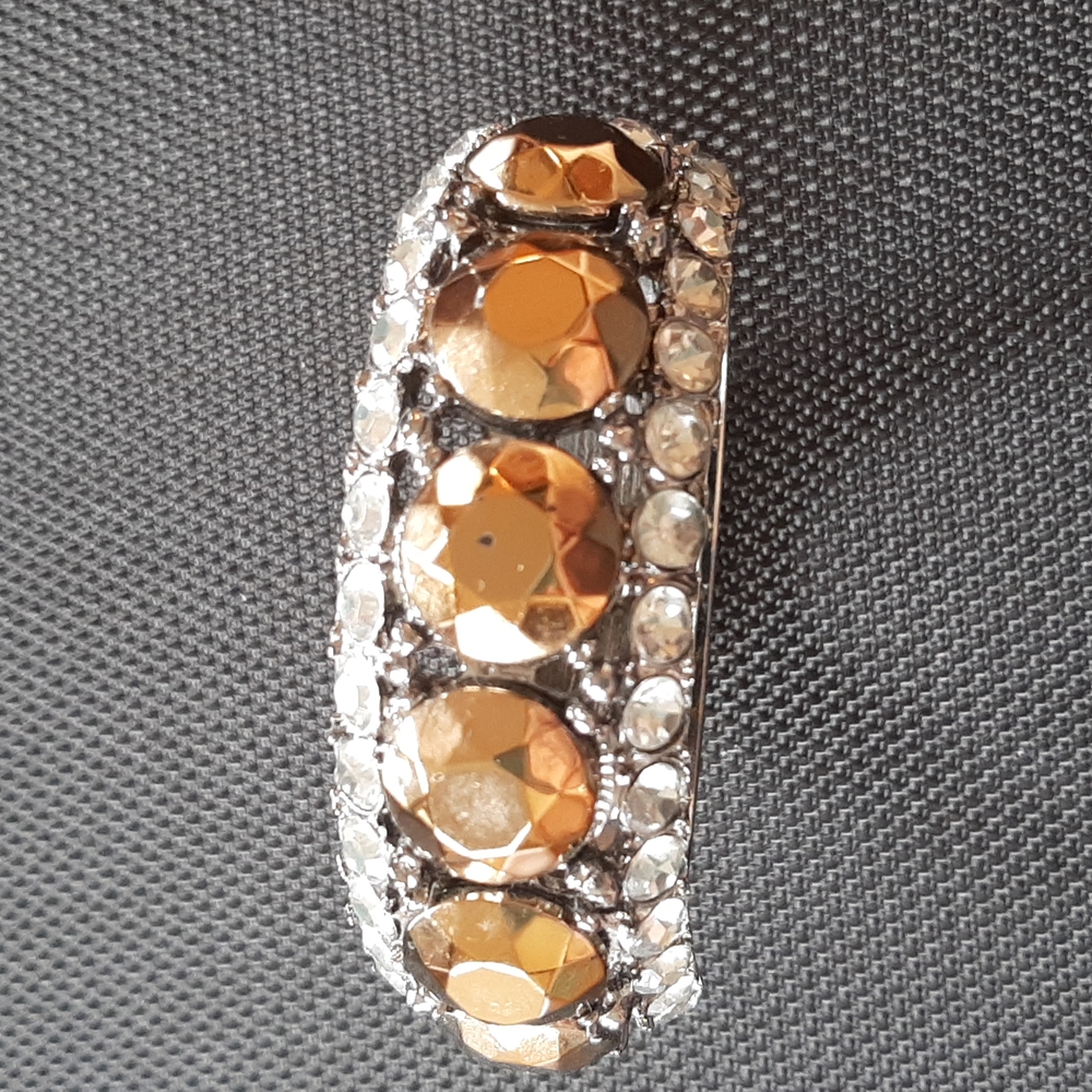 Silver tone rhinestone and faux hematite hinged bracelet